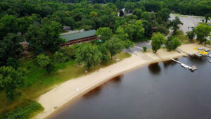 Cedar Lodge and Settlement on the lower Dells WI River, Sandy beach, boat launch and pier.