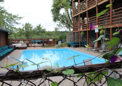 Cedar Lodge's Heated Pool: The Perfect Summer Retreat When the summer sun is shining in Wisconsin Dells, there’s no better place to relax and cool off than Cedar Lodge’s heated outdoor pool. This sparkling oasis is a favorite among guests of all ages, offering a refreshing escape with plenty of space to unwind, play, and soak up the sunshine. A Pool Designed for Relaxation and Fun Cedar Lodge’s heated pool is more than just a place to swim; it’s a summer haven. The water temperature is perfectly maintained, making it inviting for early morning dips, midday splashes, or evening swims under the stars. With ample seating and shaded areas nearby, it’s easy to find your perfect spot to lounge and relax. Perfect for Families and Groups Families love the heated pool for its safe, welcoming environment. Kids can splash and play in the shallow areas, while adults can enjoy a leisurely swim or relax poolside with a good book. The spacious deck and surrounding area make it ideal for group gatherings, whether you’re traveling with family or friends. Scenic Surroundings What sets Cedar Lodge’s pool apart is its stunning natural backdrop. Surrounded by lush greenery and just steps away from the Wisconsin River, the pool area offers a peaceful, picturesque setting. It’s the perfect place to unwind after a day of exploring the Dells or fishing on the river. Amenities to Enhance Your Experience The pool area is equipped with everything you need for a comfortable and enjoyable day: Poolside Seating: Plenty of loungers and chairs for sunbathing or relaxing in the shade. Towels Provided: No need to pack extra—Cedar Lodge has you covered. Close to Cabins and Lodge Rooms: Just a short walk from your accommodations, making it easy to take a quick dip anytime. Pair Your Pool Day with Other Activities Cedar Lodge’s heated pool is just one of the many ways to enjoy your summer stay. Spend the morning fishing with Reel Good Fishing Guide or exploring nearby attractions, then return to the lodge for a refreshing swim. It’s the perfect way to balance adventure and relaxation. Book Your Summer Getaway Whether you’re planning a family vacation, a romantic escape, or a group retreat, Cedar Lodge’s heated pool is sure to be a highlight of your stay. Combine it with the lodge’s comfortable accommodations, scenic riverfront location, and exceptional hospitality for an unforgettable summer experience.