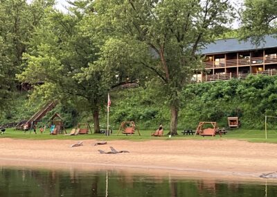 Beach on the WI River lower Dells, Cedar Lodge and settlement, cabin rentals a waterfront resort