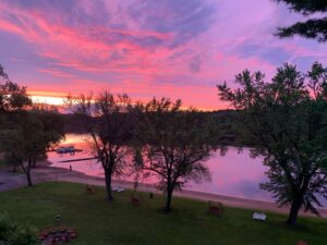 Cedar Lodge and Settlement on the lower Dells WI River, Sandy beach, boat launch and pier. Riverview from the lodge. 